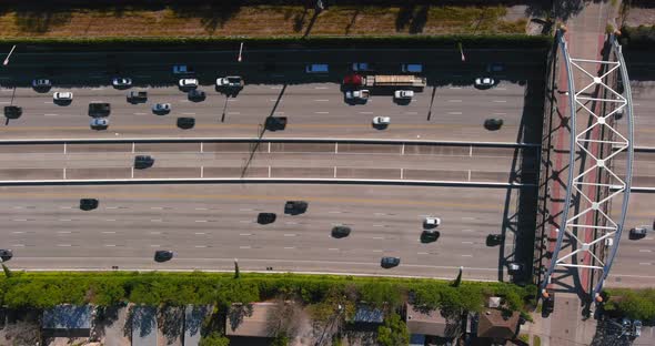 Aerial of cars on 59 South freeway in Houston, Texas on a bright sunny day alt