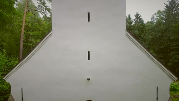 Aerial view of a traditional Chapel at the forest in Estonia. alt