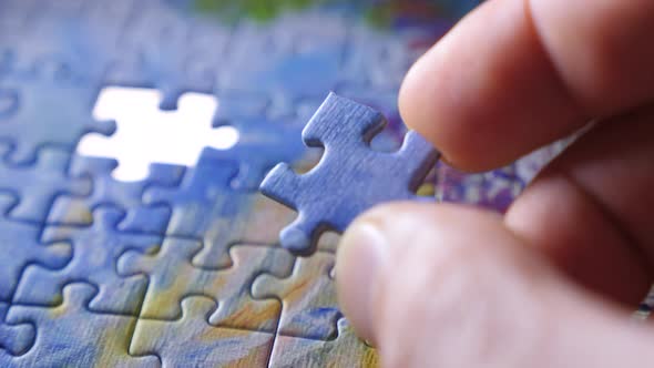 Finding the Solution Concept. Hand Matching Jigsaw Halves. Leisure Activity. Achieving the Goal Step alt