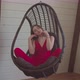 Pretty Elegant Female Relaxing in Hanging Chair - VideoHive Item for Sale