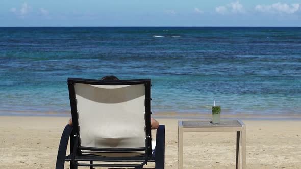 Drinking Cocktail near the Ocean alt