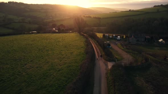 Aerial Drone Countryside Runner With Dog Road Sunrise Sunset