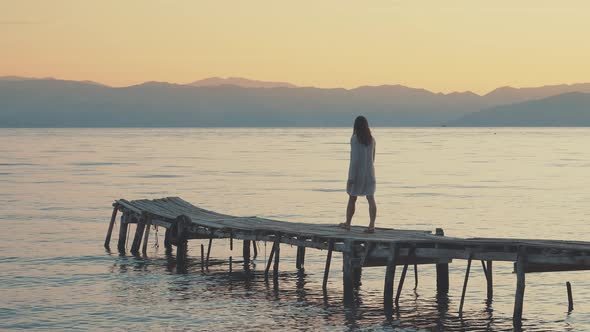 Young girl at sunrise alt