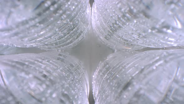 Wet Cold Plastic Bottles of Mineral Water alt