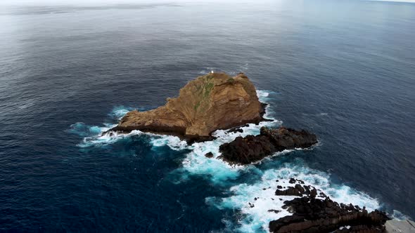 Drone Flying Forward to Ilheu Mole Cliff Near Shores of Porto Moniz, Madeira Island, Portugal
