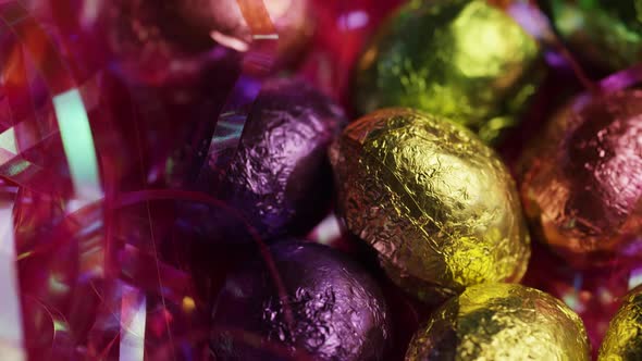 Rotating shot of colorful Easter candies on a bed of easter grass  alt