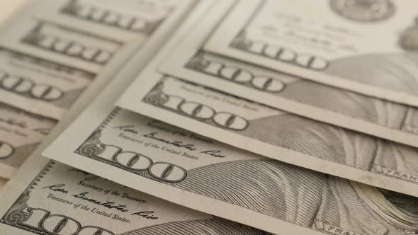 Hundred dollar close-up 4K 2160p 30fps UltraHD  tilting footage - USA  paper currency  in a row slow alt