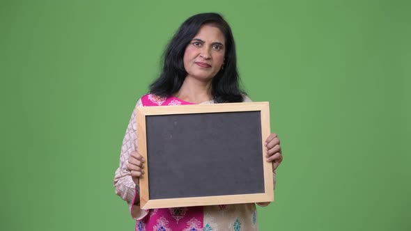 Mature Beautiful Indian Woman Showing Blackboard alt