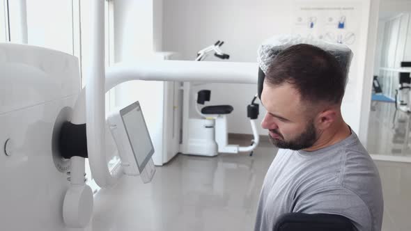 Bearded Man Having Rehabilitation After Injury in Physiotherapy Clinic alt