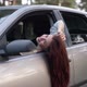 Zoom in to Happy Beautiful Woman with Long Red Hair on Driver's Seat Leaning Head on Car Door - VideoHive Item for Sale