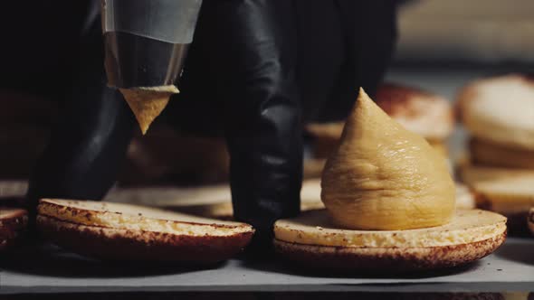 Chef Is Making Caramel Macarons, Close-up.