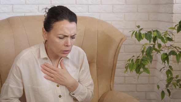 Woman Feeling Pain Breathing at Home alt