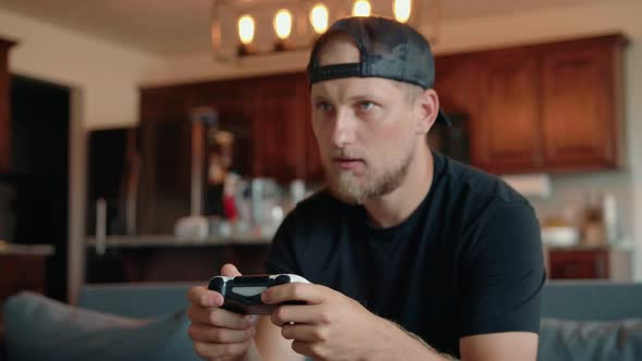 A Determined Male Gamer Who Experiences Emotional Stress When He Plays Video Games alt