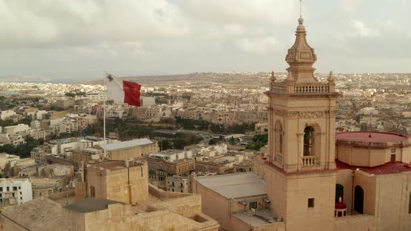 Beautiful Gozo Sand Castle Fort with Malta Flag Waving Revealing Countryside of Gozo Island, Aerial alt