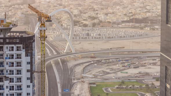 Skyscrapers and Road with Bridge Before Sunset Timelapse of Doha Qatar alt