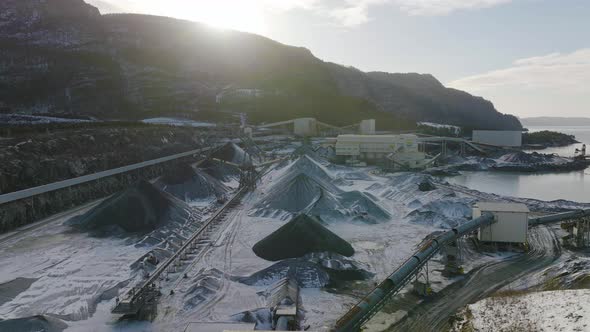 Wide angle establishing aerial shot of a mining quarry. Fossil fuel and global warming issues alt