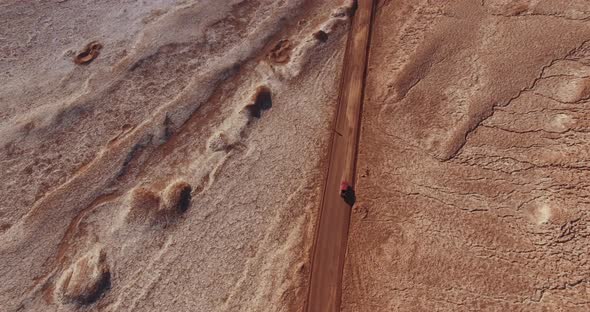 Top Down View Over the Road in an Unusual Desert Terrain of the Moon Valley in Atacama Desert, Chile alt