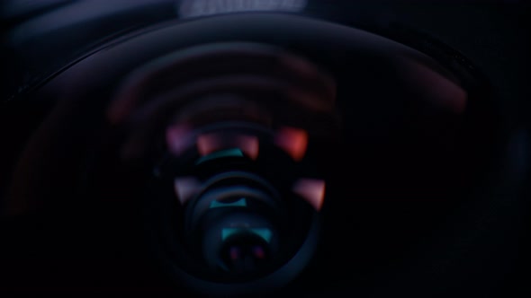 the lens of a movie camera or photo camera is shot in close-up alt