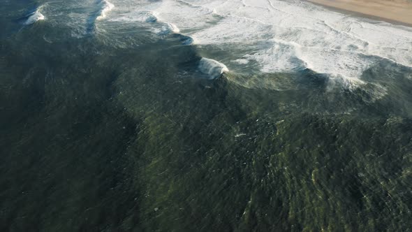 Picturesque Spit with Offshore Wind Farm in the Background alt