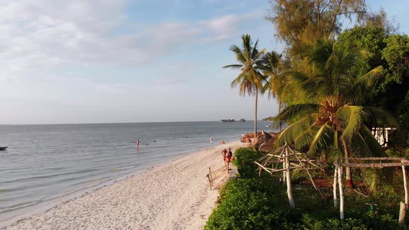 Paradise Coast Resort with Palm Trees and Hotels By Ocean Zanzibar Aerial View alt