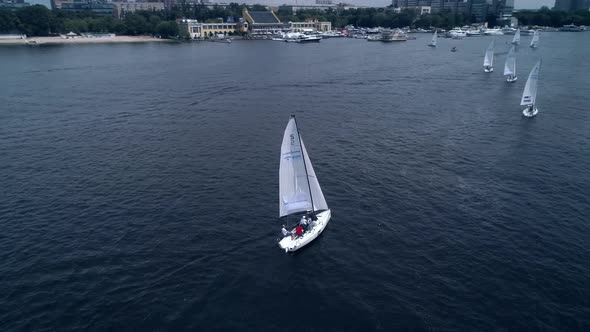 Turning Aerial View of Yacht Navigating on the River