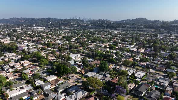Los Angeles Suburb Flyover With Downtown La In Background alt