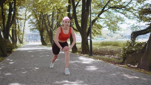 Athletic Fitness Sport Motivated Runner Girl Training Preparing to Run Race Marathon Start in Park alt