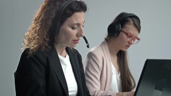 Call Center Operators Wearing Headphones