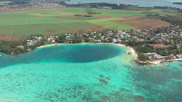 Tropical Island with Coco Palm Trees Wooden Villas White Sand and Turquoise Crystal Clear Water