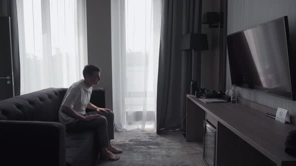 Man Resting in a Hotel Room alt