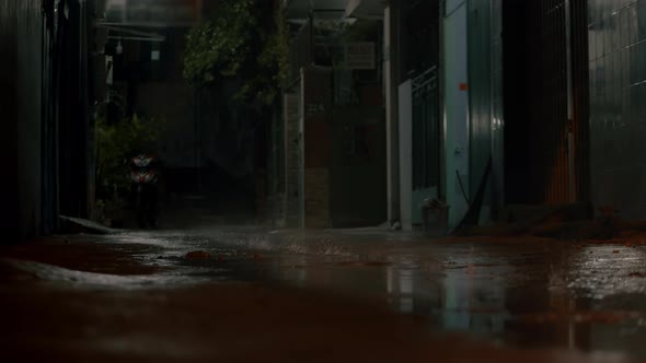 Closeup at Night Drops of Summer or Autumn Rain Fall on the Asphalt in the City Near Residential alt