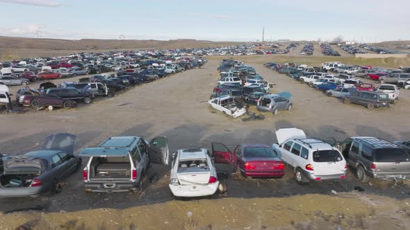 Aerial Footage of the Junk Yard Within Barren Deserted Landscape alt
