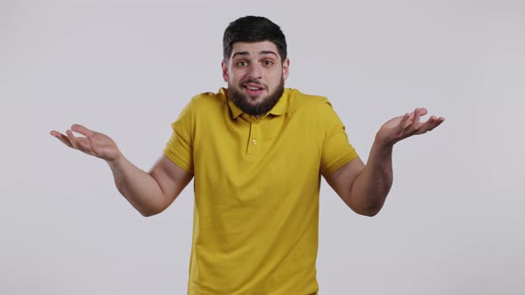 Indifferent Unsure Man Makes Gesture of I Dont Know Cant Help Anything alt