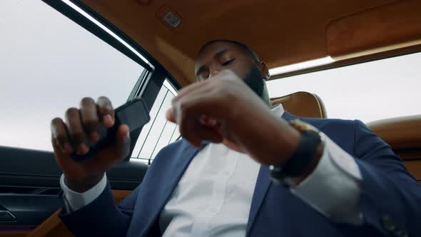 Portrait of Afro Businessman Dancing at Car. Business Man Counting Money at Car alt