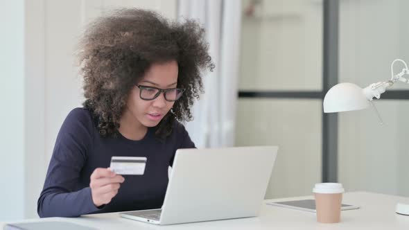 Successful Online Shopping on Laptop By African Woman alt