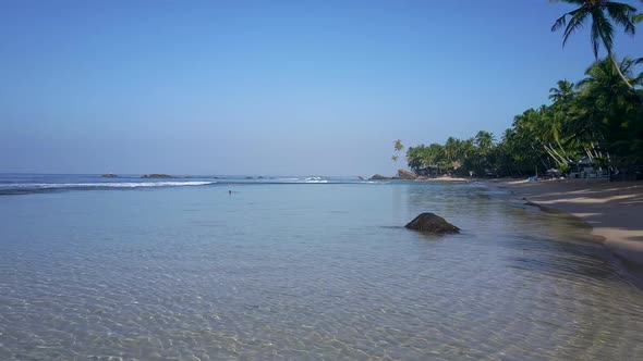 Transparent Ocean Water Over Sandy Bottom Surround Grey Rock alt