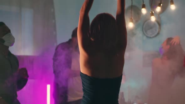 Woman Dancing During Pandemic Party alt
