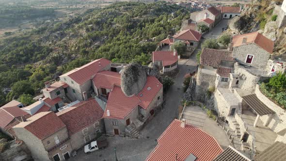 Aerial of iconic medieval Portuguese village of Monsanto on mountainside