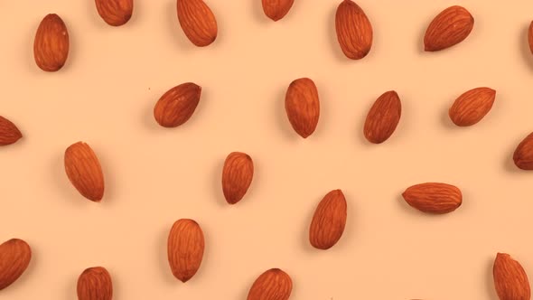 Rotating Background Nuts Almonds on a Beige Background the Concept of Healthy Eating Food Design