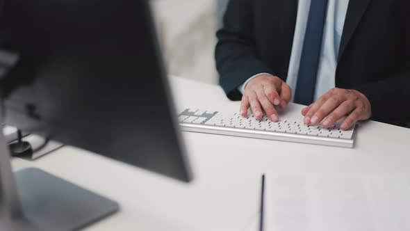 Businessman Typing on Keyboard