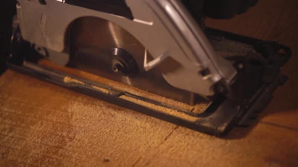 Working Disk Saw Is Sawing Wooden Board, Close Up in Carpentry alt