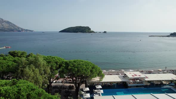 Aerial View Budva Beach By Sea with Sun Loungers and People Seashore Montenegro alt