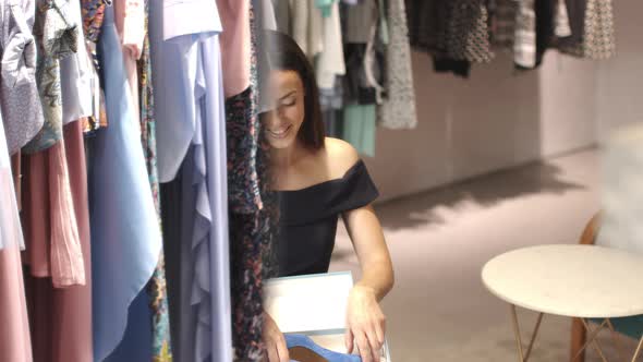 Happy woman taking new shoes from box alt