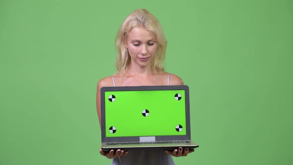 Young Happy Beautiful Businesswoman Showing Laptop