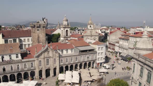 Sideways drone view of Republic Square in Braga on market day, Portugal. Aerial pov alt
