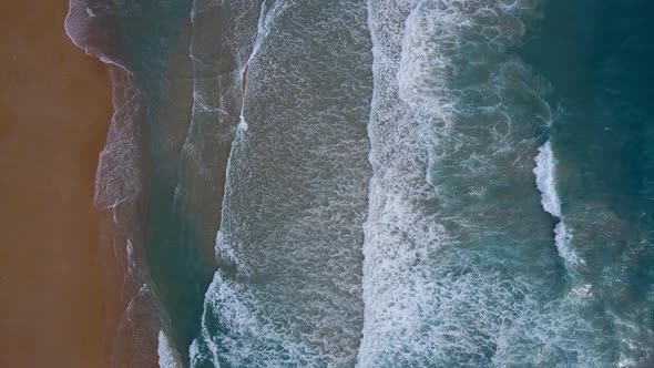 Aerial view top view beach and seawater on sandy beach in summer. Nature and travel concept. alt