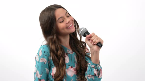 Happy Teen Girl Singer Singing or Covering Events As Blogger with Microphone Communication