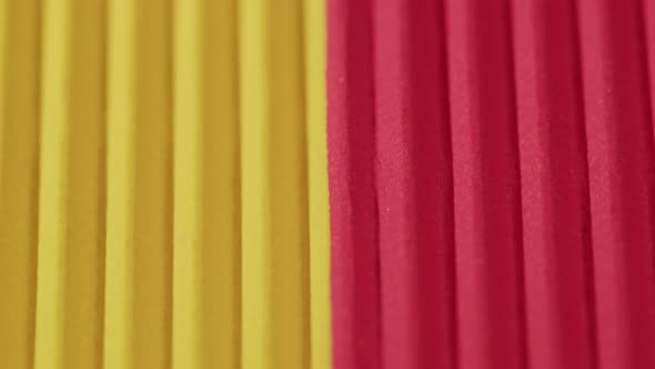 Yellow and Red Ribbed Paper Closeup alt