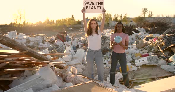 Ecology Activists Holding Signs Agains Pollution at Trash Pill alt