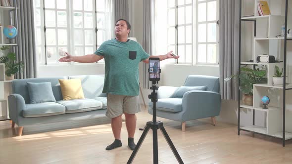 Asian Man Blogger Shoots Video Content For Social Networks, Magician With Playing Cards alt